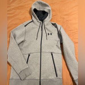 Under Armour hoodie, grey in colour, size Med.